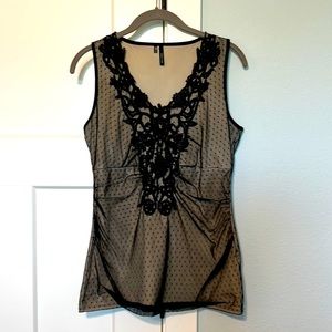 Maurice’s size medium black lace mesh overlay on nude tank. Excellent condition.